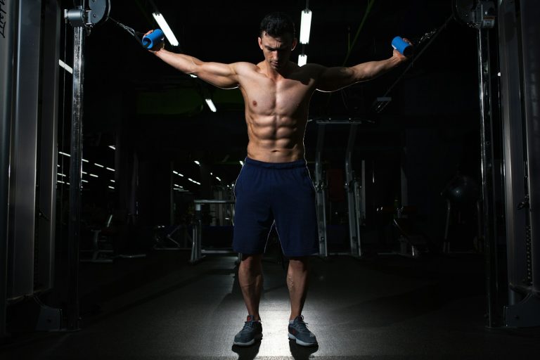 Anavar vs Anadrol man exercising inside dim room